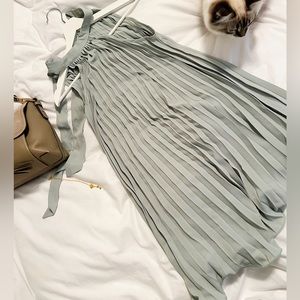 Sage green pleated dress.